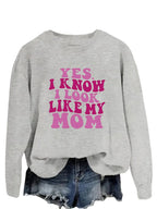 Plush Fashion Hub graphic sweatshirt with "Yes I Know I Look Like My Mom" print, cozy pullover in soft fabric.