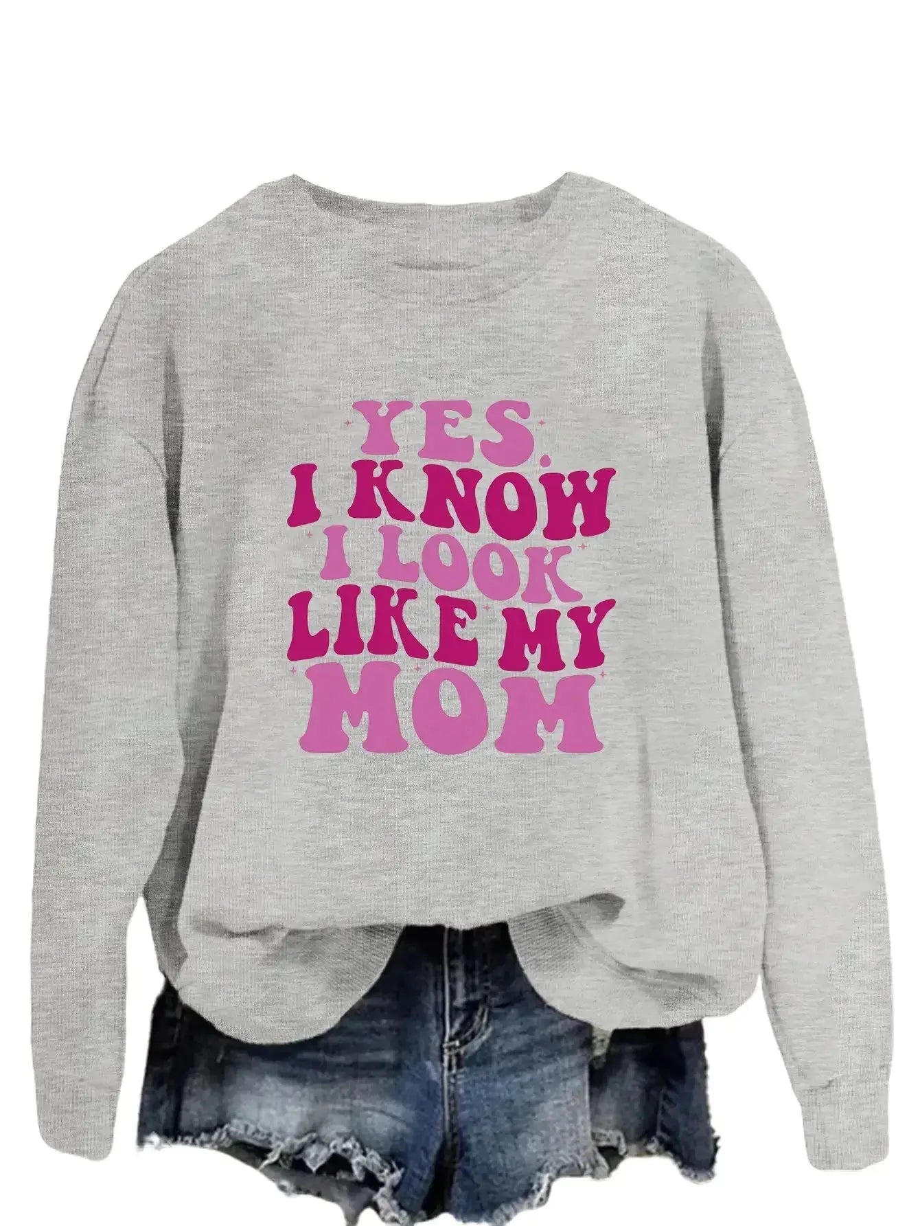 Plush Fashion Hub graphic sweatshirt with "Yes I Know I Look Like My Mom" print, cozy pullover in soft fabric.