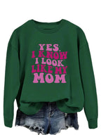 Cozy plush fashion sweatshirt with "Yes I Know I Look Like My Mom" graphic print, casual pullover from Plush Fashion Hub.