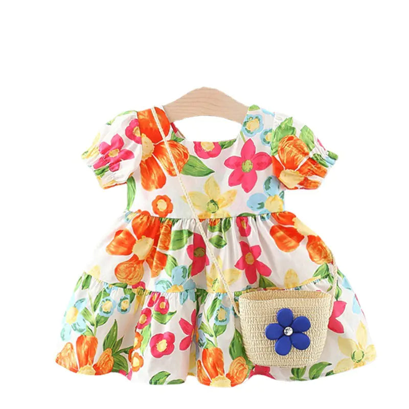 Girls' floral dress with matching bag from Trendy Attic Store01, featuring colorful flower patterns and a stylish design.