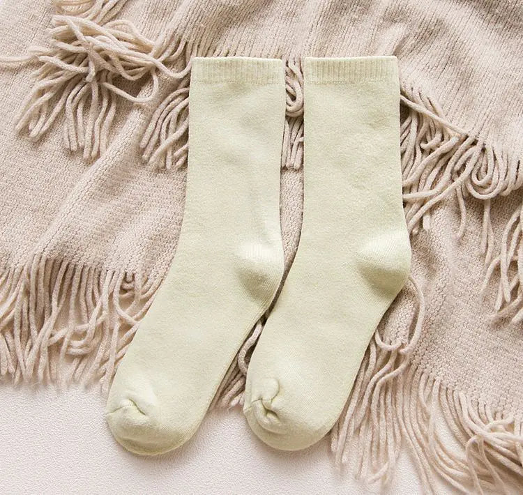 Thick cotton women's thermal socks for autumn and winter, cozy and warm, in a neutral color, designed for cold weather comfort.
