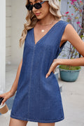 VYSN V-neck sleeveless denim dress displayed on a hanger, showcasing its casual sleeveless design and classic denim fabric.
