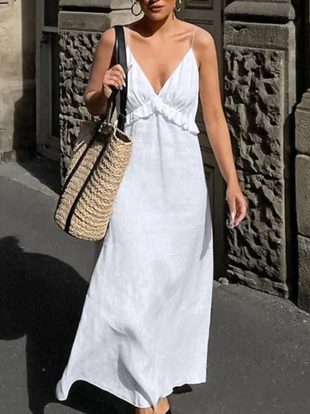 Women's ruffled V-neck cotton maxi dress with flowing boho style and summer design, featuring ruffle details and a relaxed fit.