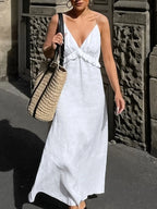 Women's ruffled V-neck cotton maxi dress with flowing boho style and summer design, featuring ruffle details and a relaxed fit.