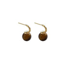 Shopimist Tiger Eye ball drop earrings featuring smooth, polished tiger eye gemstone beads hanging from delicate metal hooks.