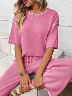 Women's casual two-piece lounge set with round neck top and drawstring pants by Trendsi, shown in a relaxed fit.