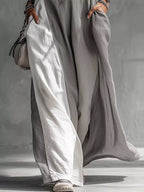 Two-tone sleeveless maxi dress by Plush Fashion Hub, elegant casual floor-length summer gown with a stylish design.