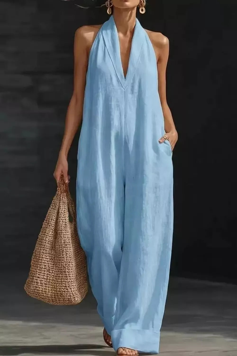 Women's sleeveless wide-leg jumpsuit by Trendsi, casual chic romper with pockets, featuring a relaxed fit and stylish design.