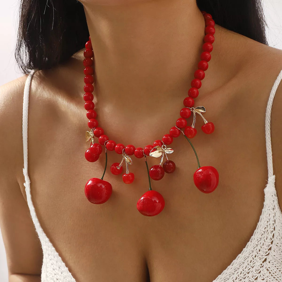 Beaded cherry charm statement necklace from Plush Fashion Hub featuring colorful beads and a cherry pendant.