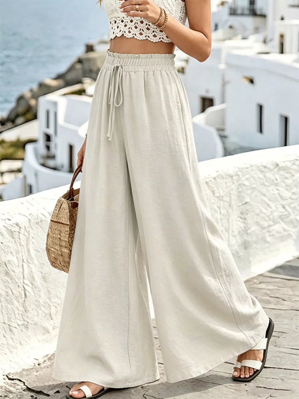 Wide leg drawstring pants by Plush Fashion Hub, featuring a relaxed fit and casual style, shown in a natural fabric and color.