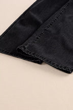 High-waisted button-fly wide-leg jeans from Trendsi, shown folded with visible stitching and classic denim texture.