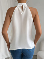 Chic ruffle halter neck sleeveless blouse for women, elegant office top by Trendsi, featuring ruffle detailing and a stylish halter design.