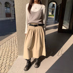 Casual FitiqueFit crushed pleat cotton midi skirt with belt, relaxed A-line design, shown on a model.