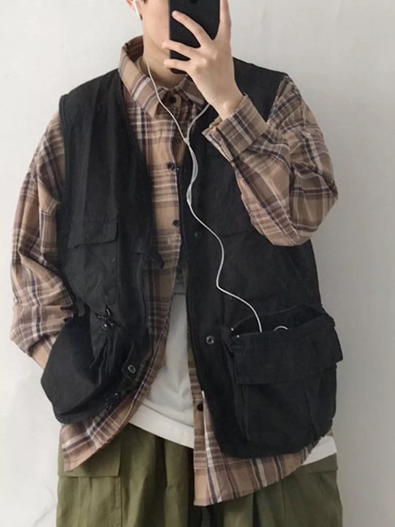 Men's multi-pocket cargo vest by Plush Fashion Hub with multiple utility pockets, lightweight design, and casual outdoor style.