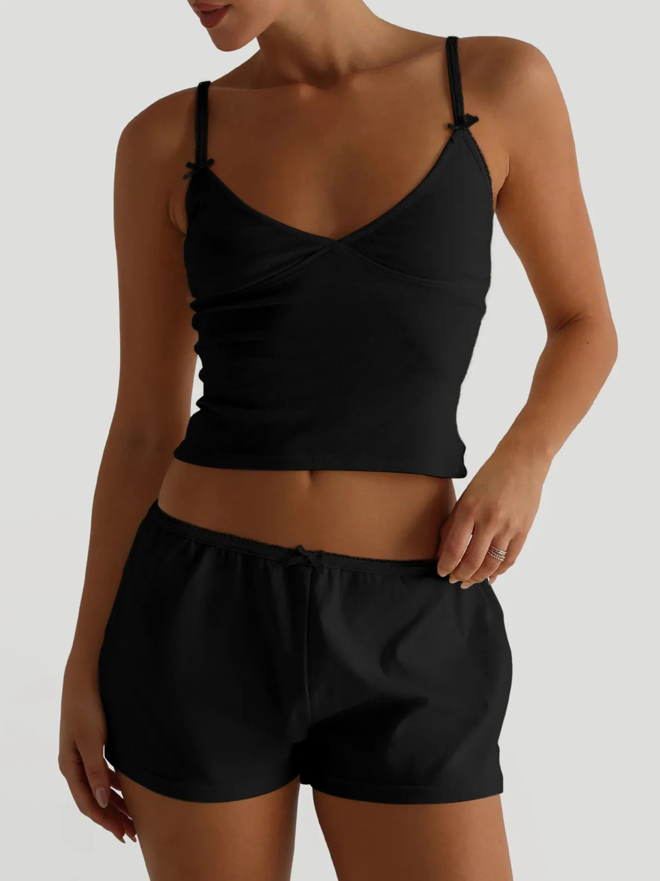 Trendsi V-neck cami and shorts activewear set in lightweight fabric, featuring a V-neck top and matching shorts for comfortable workout attire.