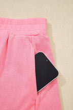 Shopimist sleeveless cropped top and pocketed skort set shown on a model, ideal for casual summer wear.