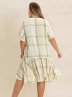 Plus size plaid flutter sleeve dress from Shopimist, featuring a stylish checkered pattern and flowing fabric for a comfortable fit.