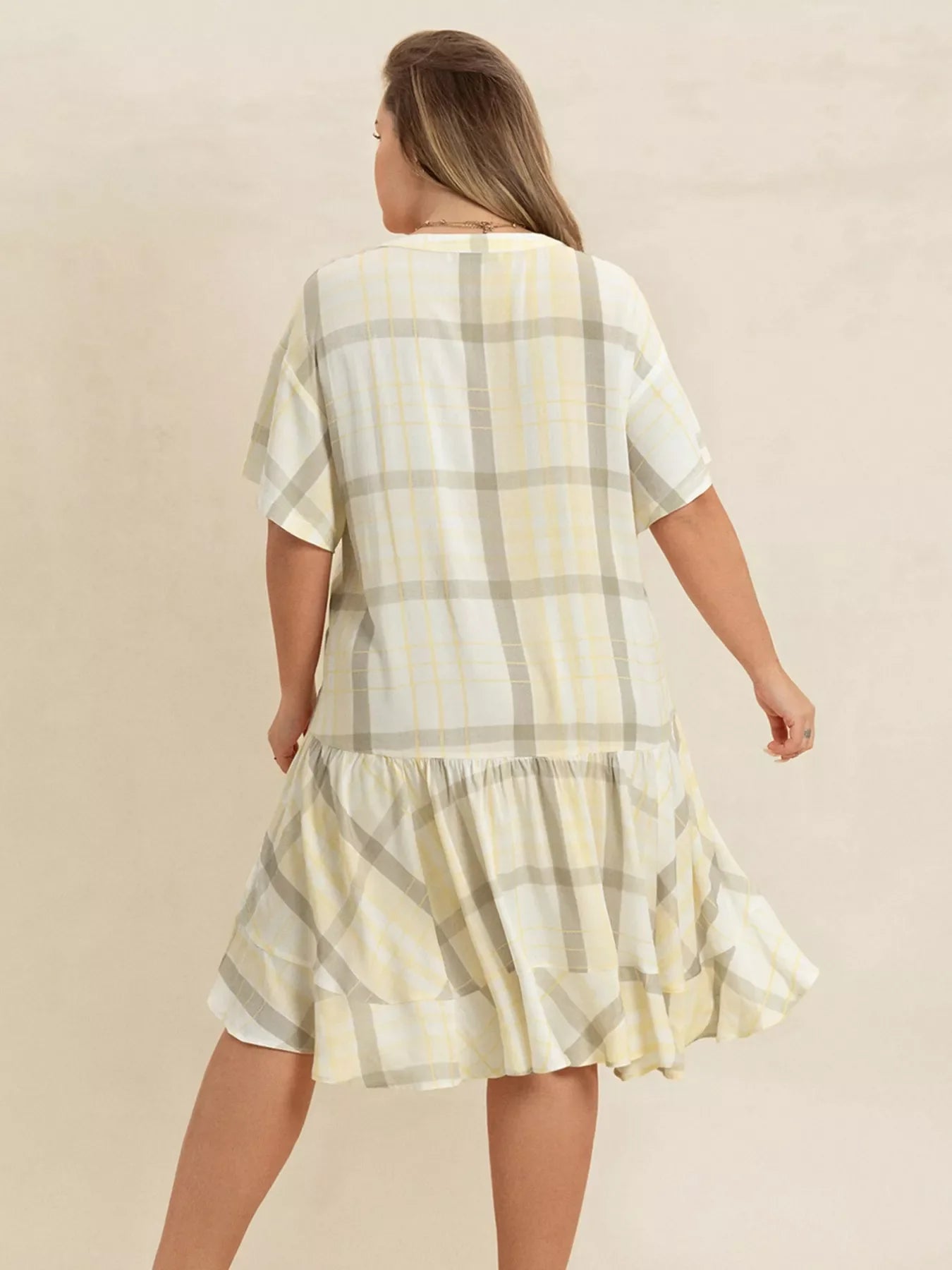 Plus size plaid flutter sleeve dress from Shopimist, featuring a stylish checkered pattern and flowing fabric for a comfortable fit.