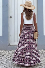 Plush Fashion Hub geometric print smocked waist maxi skirt, flowing dress with vibrant pattern and comfortable fit.