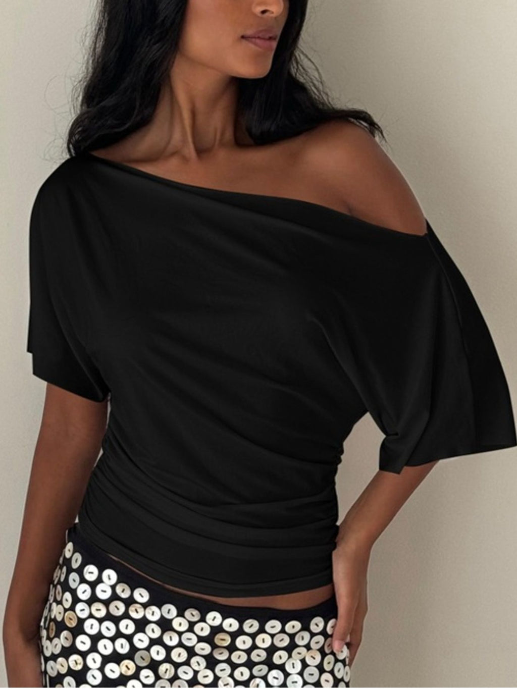 Women's one-shoulder ruched short sleeve T-shirt by Trendsi, featuring a chic stretch fabric and stylish asymmetrical design.