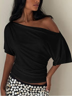 Women's one-shoulder ruched short sleeve T-shirt by Trendsi, featuring a chic stretch fabric and stylish asymmetrical design.
