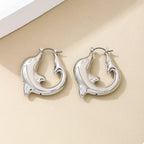 18K gold-plated dolphin hoop earrings featuring sleek, shiny dolphin-shaped hoops perfect for ocean-inspired jewelry styles.