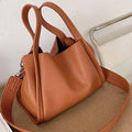 LadyShow.Store Kira handbag, stylish leather tote with top handles and spacious interior, perfect for daily use.