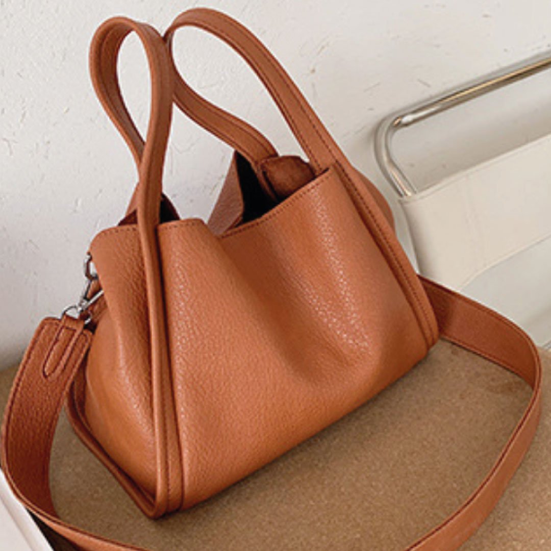 Plush Fashion Hub Kira handbag with soft plush material and stylish design, featuring a top handle and spacious interior.