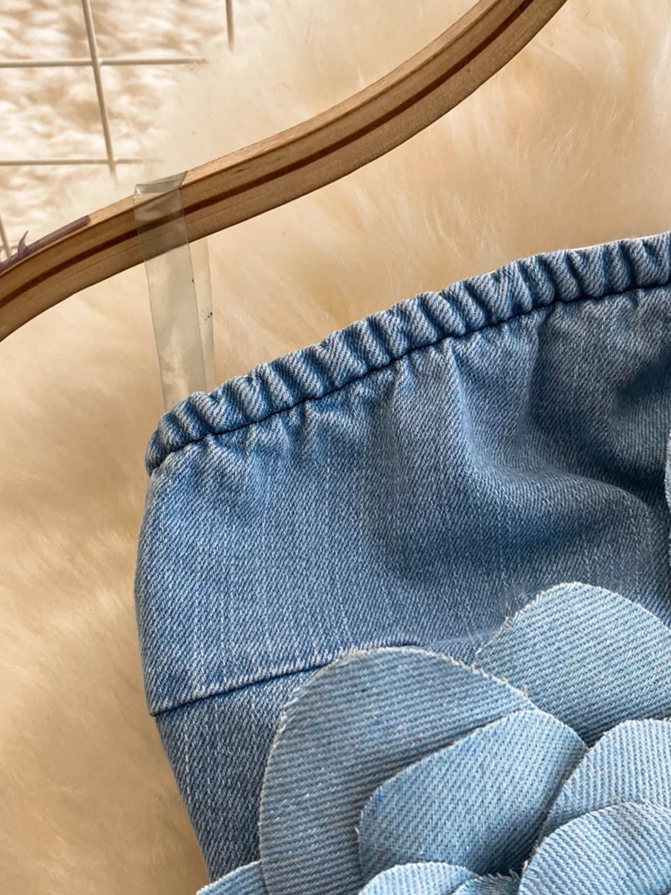 Strapless denim dress with floral appliqué details, showcasing a trendy, casual dress style by Trendsi.