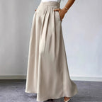 Women's high-waist pleated wide-leg linen pants in relaxed bohemian style, casualwear from FitiqueFit.