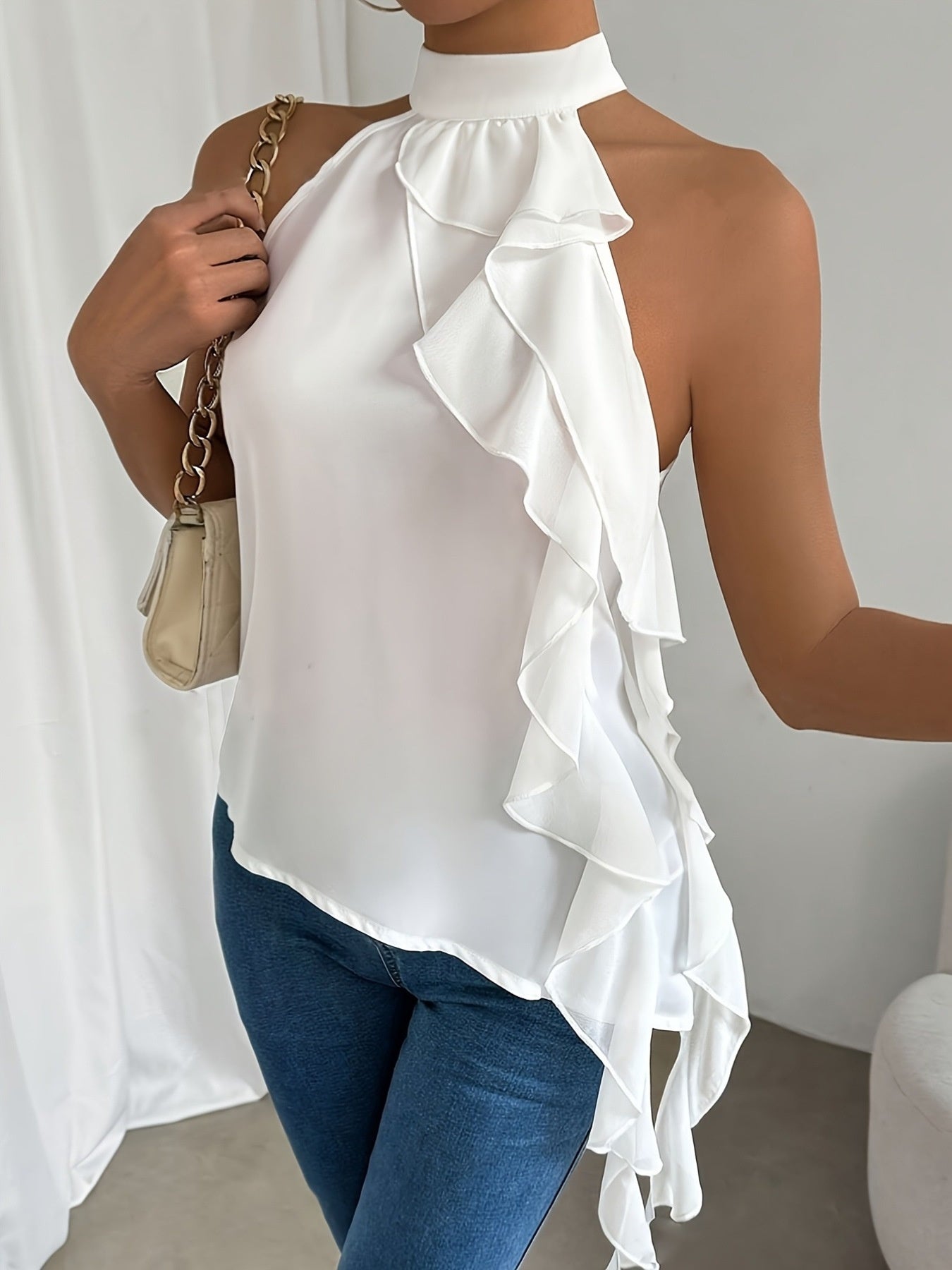 Elegant women's ruffle halter neck sleeveless blouse from Trendsi, perfect for office wear, featuring a chic and stylish design.