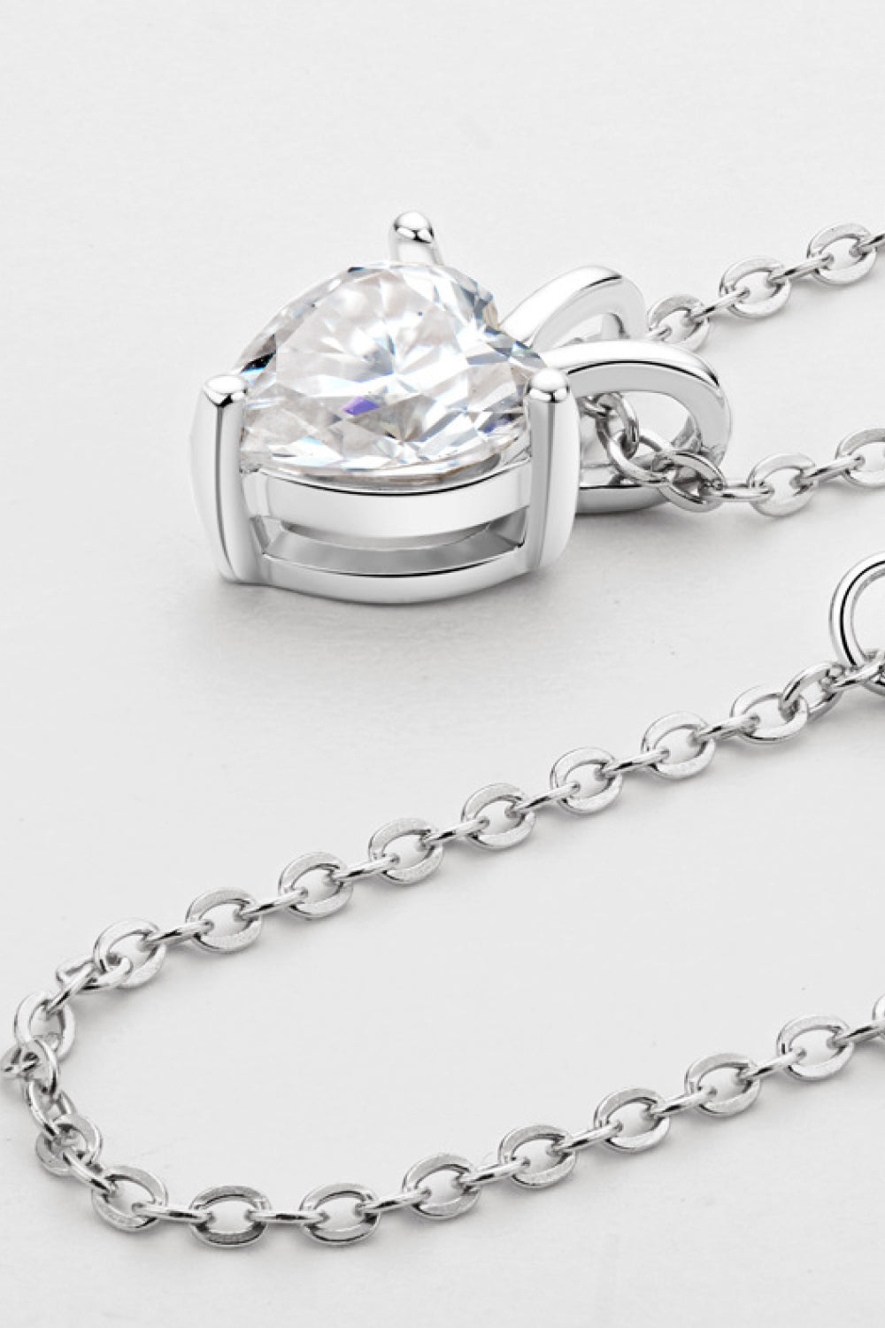 Heart-shaped 1 carat moissanite pendant necklace by Shopimist featuring a sparkling gemstone on a delicate chain.