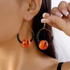 Gold-plated Halloween bead earrings with spooky themed beads, stylish jewelry accessory by Shopimist
