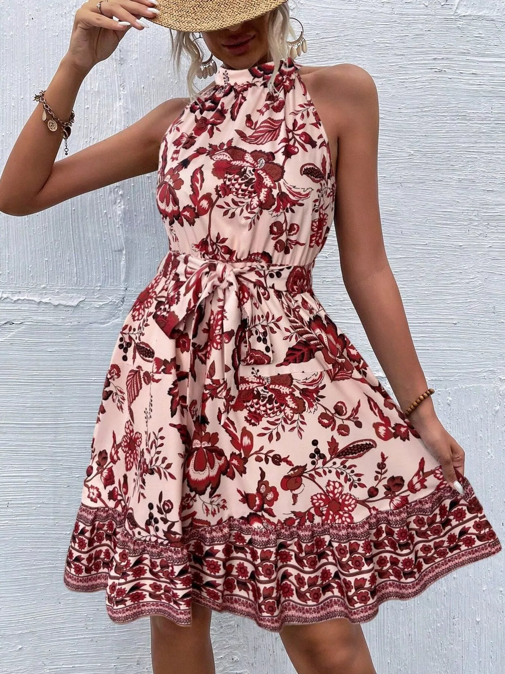 Printed sleeveless tie waist dress from Shopimist featuring a vibrant pattern and a flattering waist tie detail.