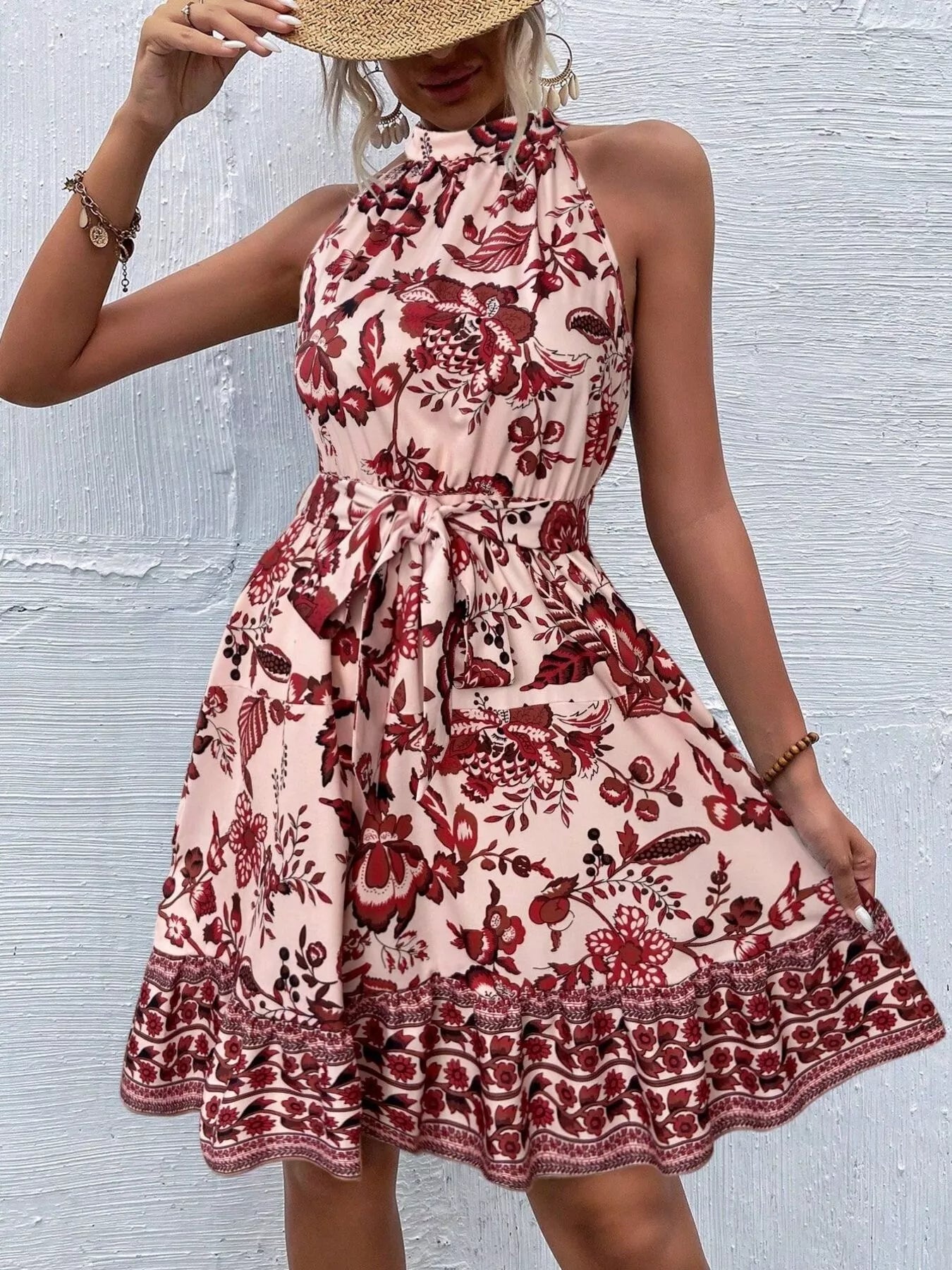 Printed sleeveless tie waist dress from Shopimist featuring a vibrant pattern and a flattering waist tie detail.