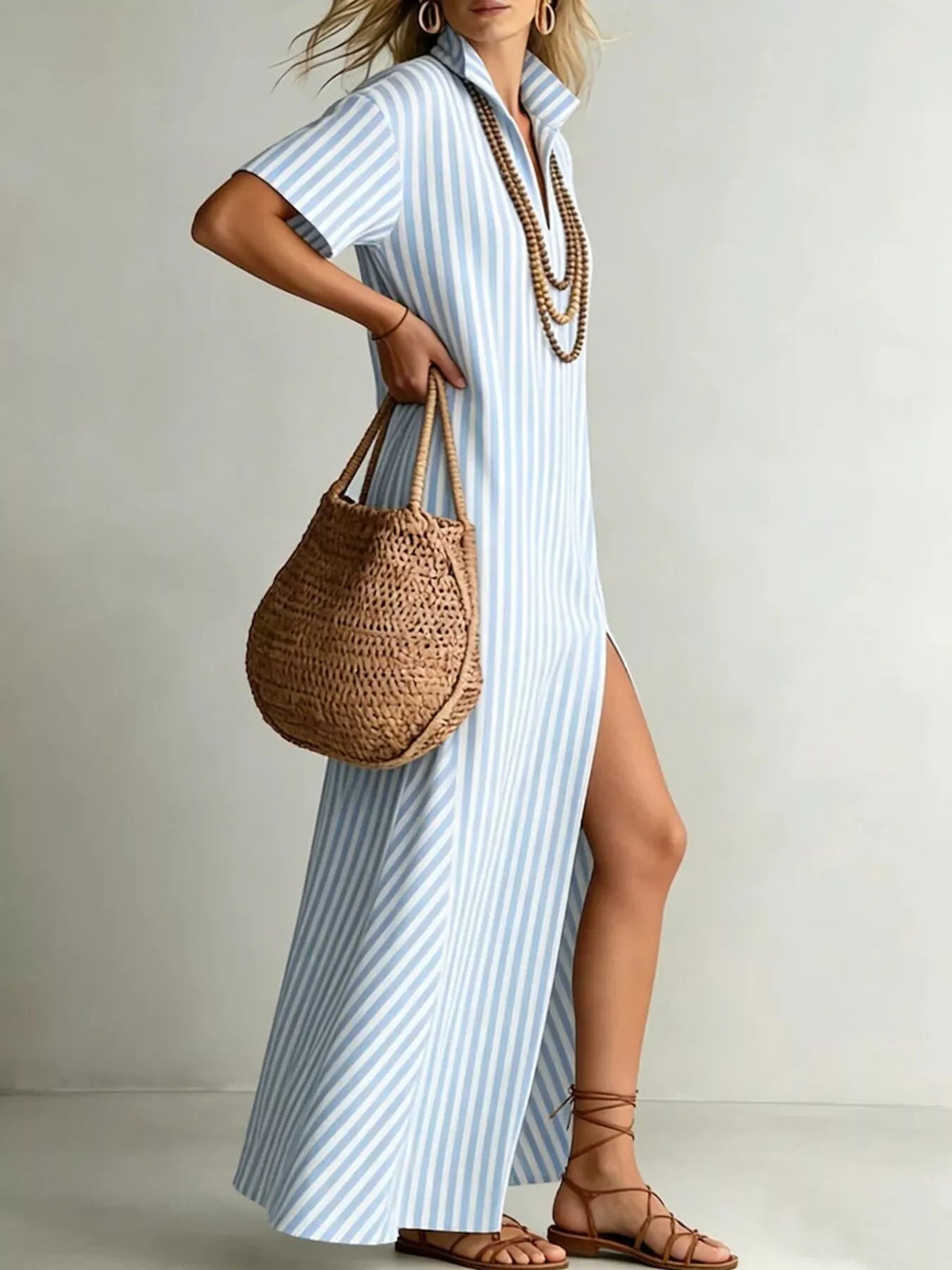 Striped high slit maxi shirt dress by Plush Fashion Hub featuring a flowing design and bold vertical stripes.
