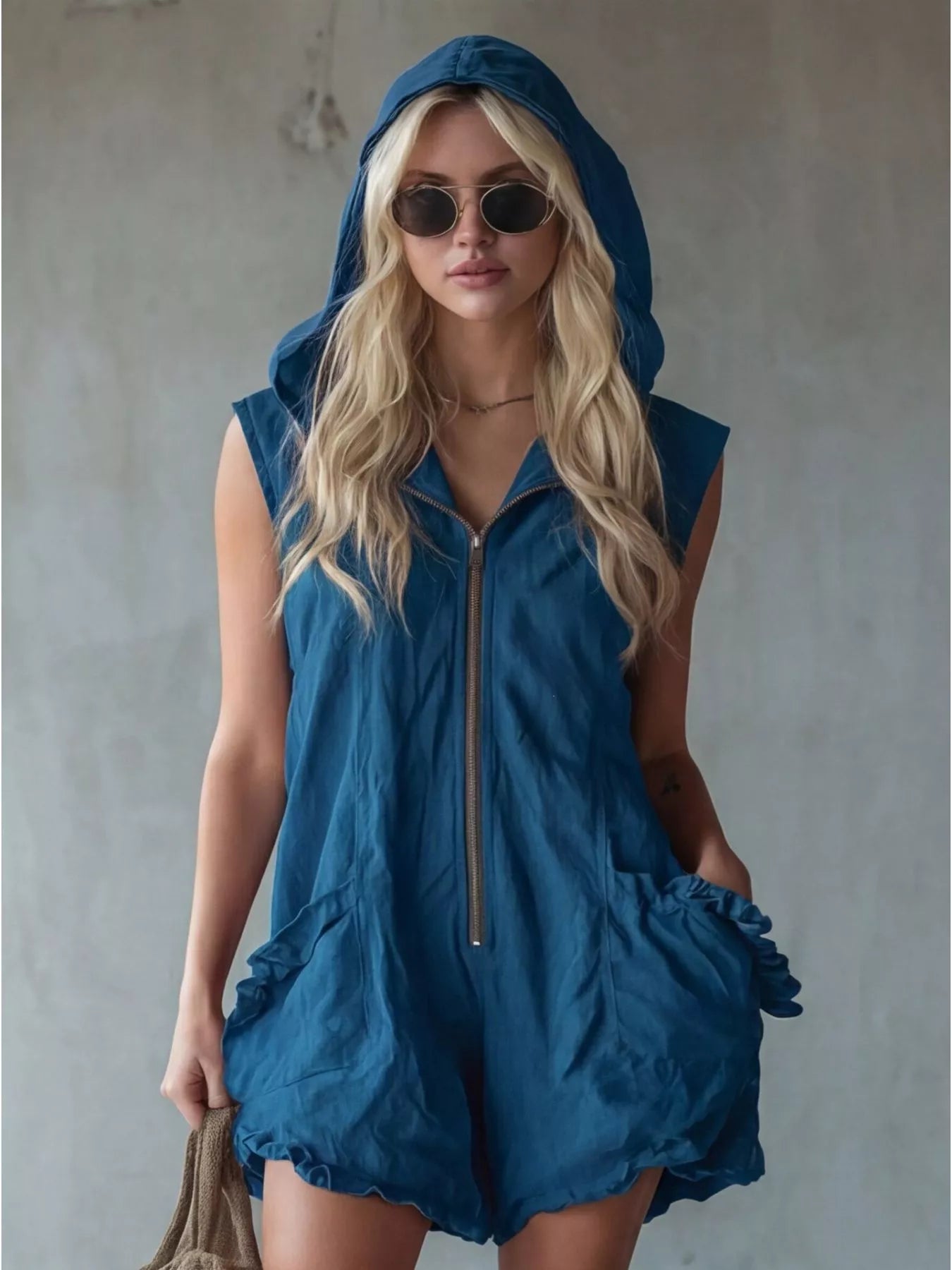 Plus size hooded sleeveless zipper jumpsuit by Shopimist with ruffled pockets, full-length, casual romper with a hood and sleeveless design.