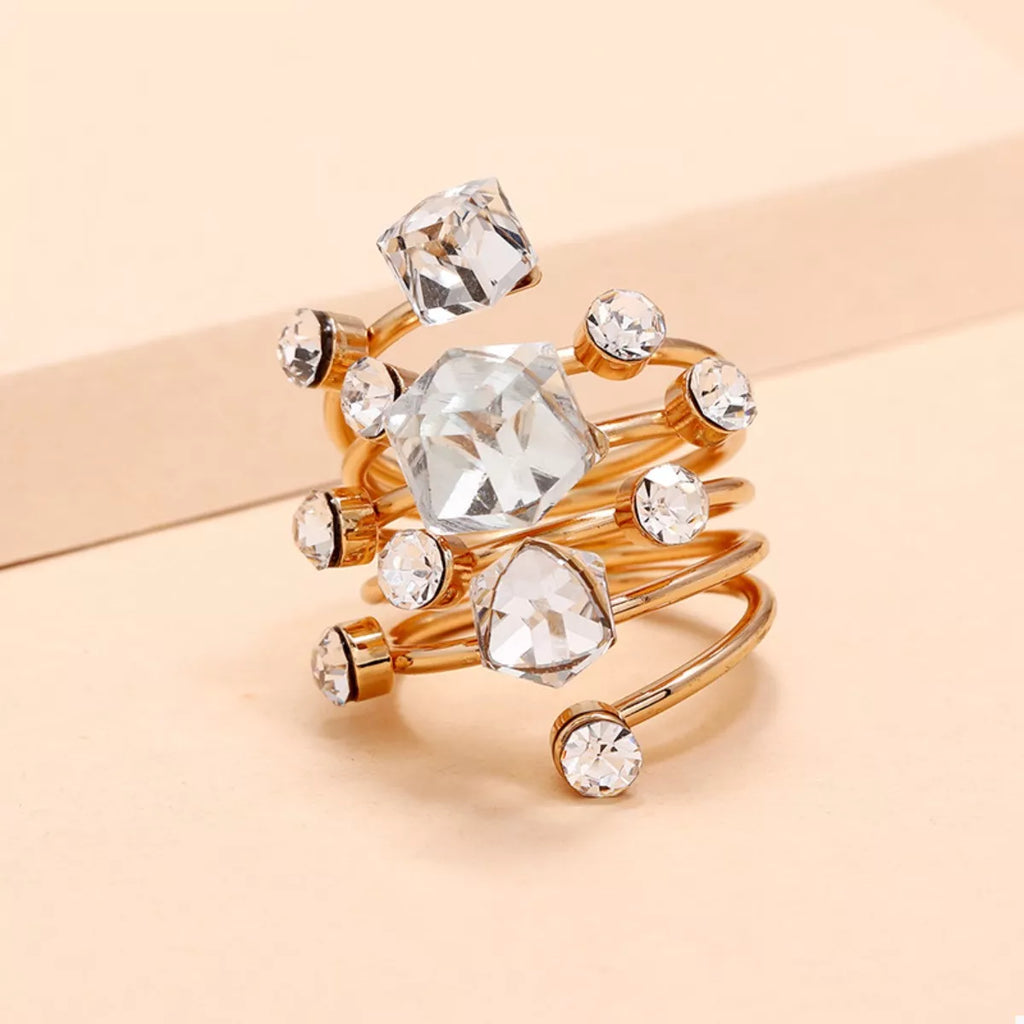 18K gold-plated multi-layered ring with intricate bands and textured details, showcasing elegant jewelry craftsmanship.