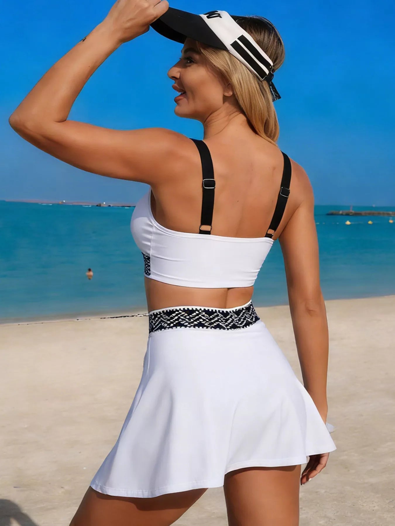 Contrast trim tank top and skort swim set by Trendsi, featuring a stylish two-piece design with vibrant colors and comfortable fit.