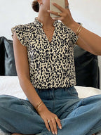 Leopard print ruffle sleeve blouse from Plush Fashion Hub, featuring a stylish design and feminine ruffle details.