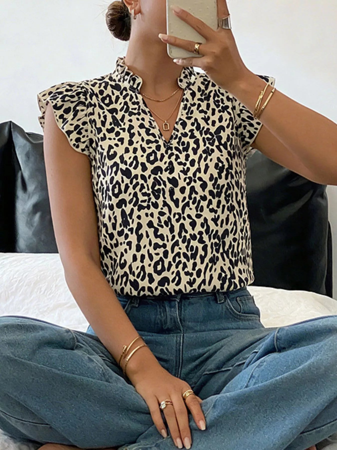 Leopard print ruffle sleeve blouse from Plush Fashion Hub, featuring a stylish design and feminine ruffle details.