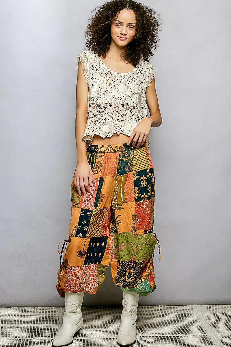 Printed patchwork wide leg cotton pants with side drawstring, casual dress style, shown with a relaxed fit and colorful fabric details.