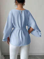 Shopimist batwing sleeve belted blouse featuring a flowy design and stylish belt, shown on a model with a modern, chic look.