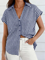 Women's classic gingham print button-down shirt with tie detail, featuring long sleeves and a fitted collar, by Trendsi.