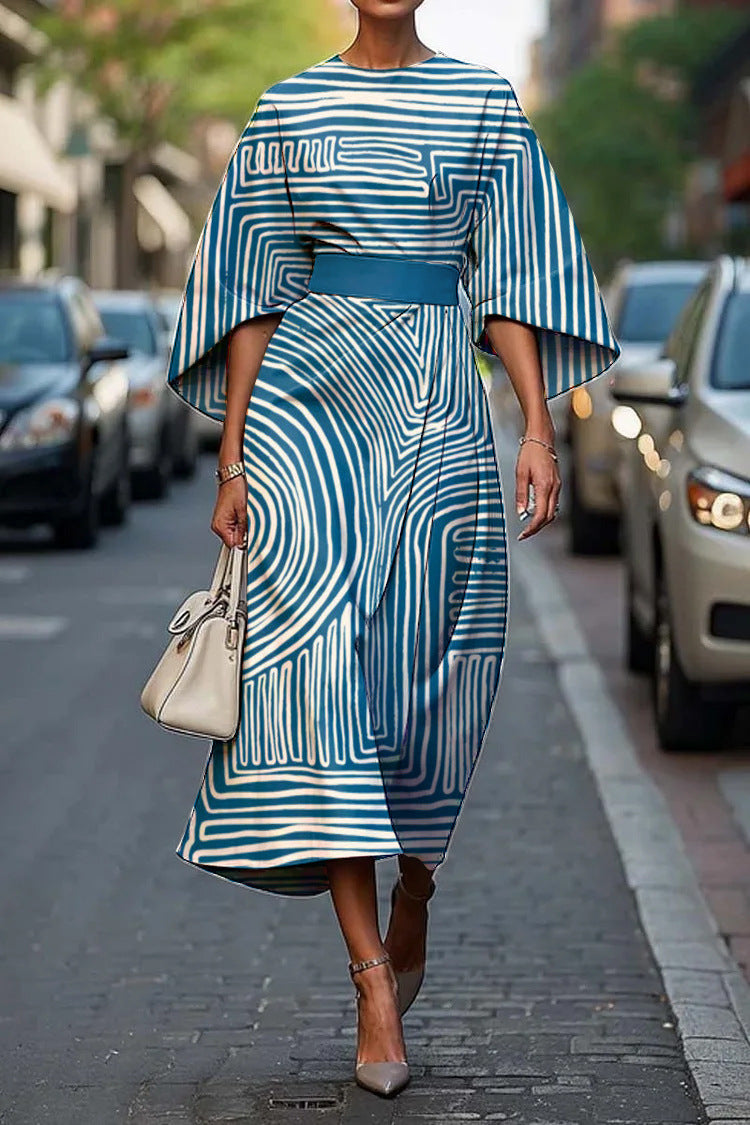 Flowy maxi dress with geometric print and batwing sleeves from Plush Fashion Hub, showcasing a casualwear style in XS to XXXL sizes.