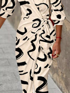 Printed collared neck shirt dress from Plush Fashion Hub featuring a stylish design and button-down front.
