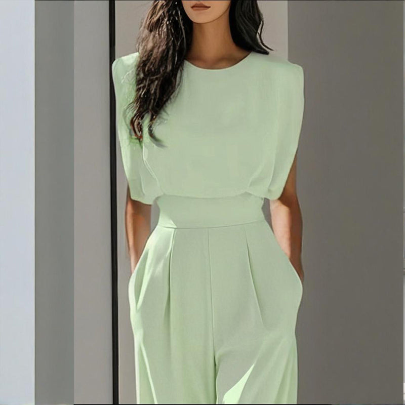 Women’s casual FitiqueFit wide-leg short sleeve jumpsuit hanging on a hanger, showcasing relaxed fit and stylish design.