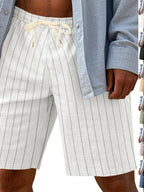 Men's full size striped casual shorts with drawstring waist from Trendsi, featuring a comfortable relaxed fit and vibrant stripe pattern.