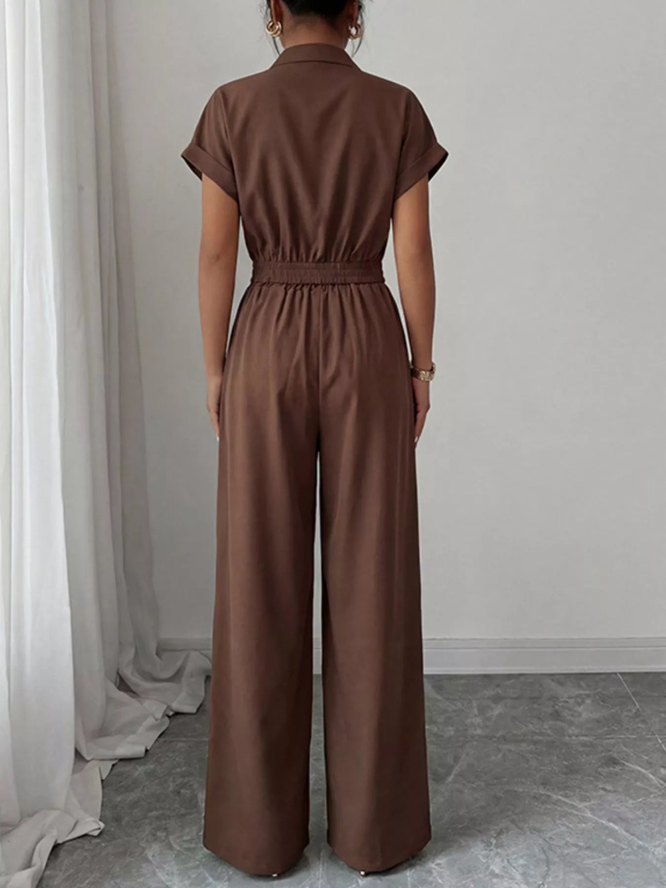 Shopimist cargo pocket zipper front jumpsuit featuring a utilitarian design with multiple pockets and a front zipper closure.