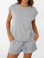 Women's soft round neck cap sleeve lounge set with drawstring shorts from Plush Fashion Hub, shown on a model.